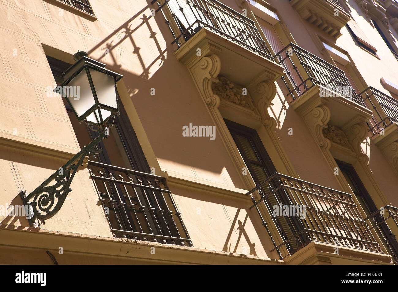 Looking up at traditional, decorative architecture of rows of