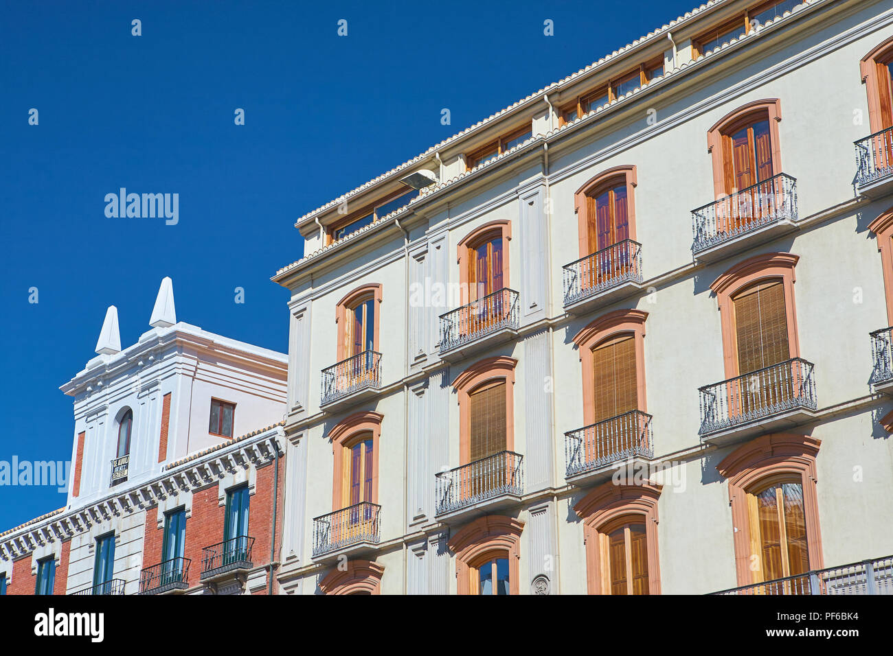 Looking up at traditional, decorative architecture of rows of