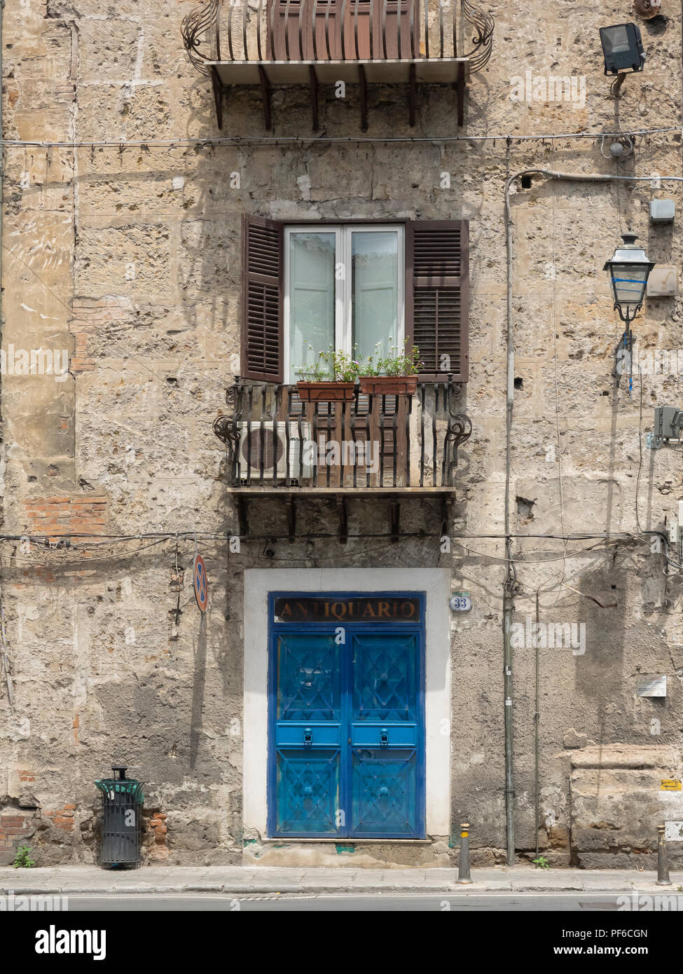 PALERMO, SICILY, ITALY MAY 21, 2018 Apartment Building with bright blue door in the city