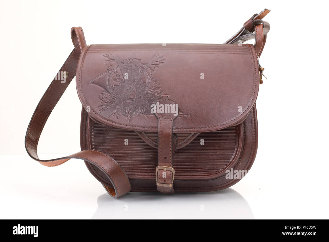 Leather hunting bag with brown ornament with patronage on white