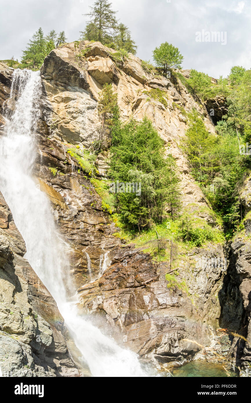 waterfall in the mountains among the rocks Stock Photo - Alamy
