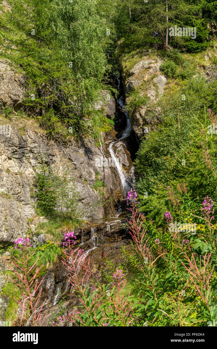 waterfall in the mountains among the rocks Stock Photo - Alamy