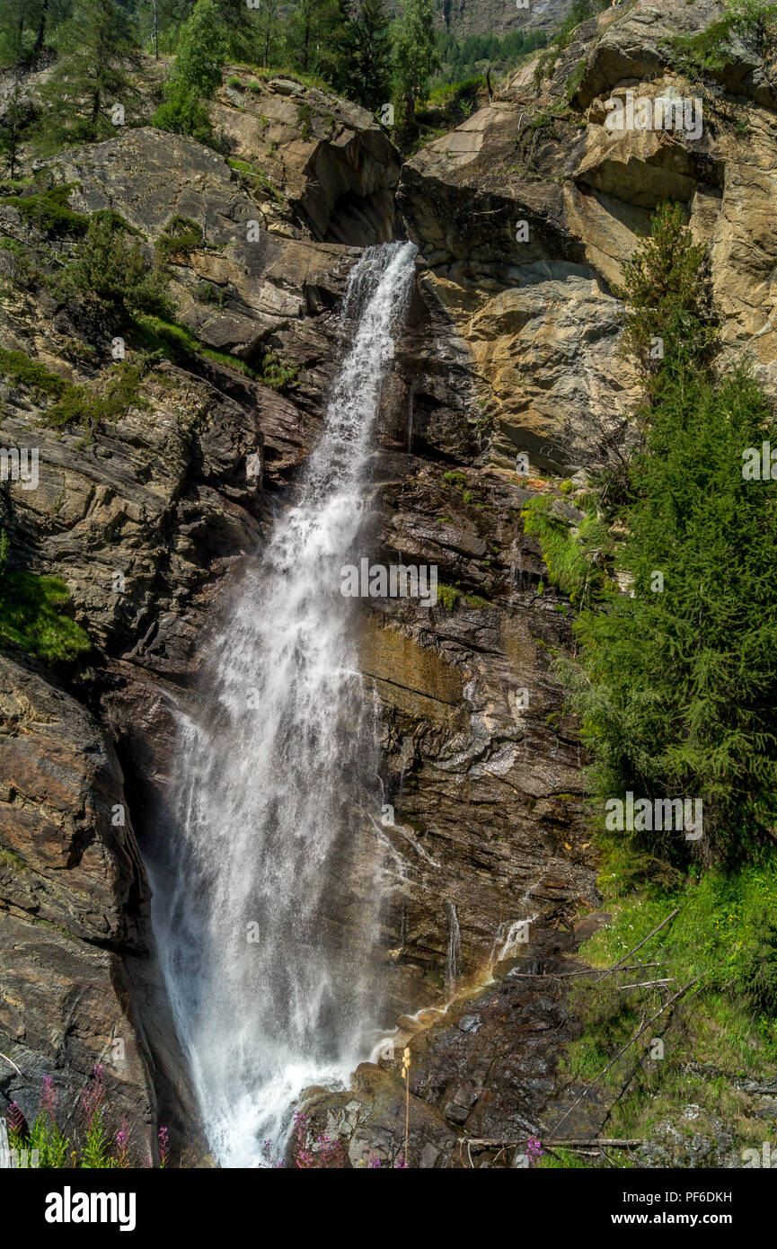 waterfall in the mountains among the rocks Stock Photo - Alamy