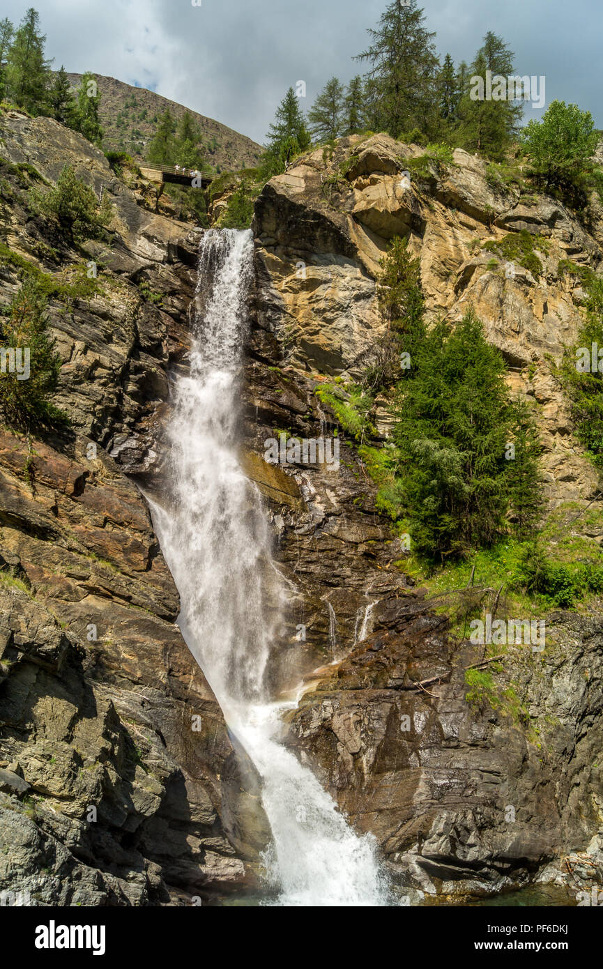 waterfall in the mountains among the rocks Stock Photo - Alamy