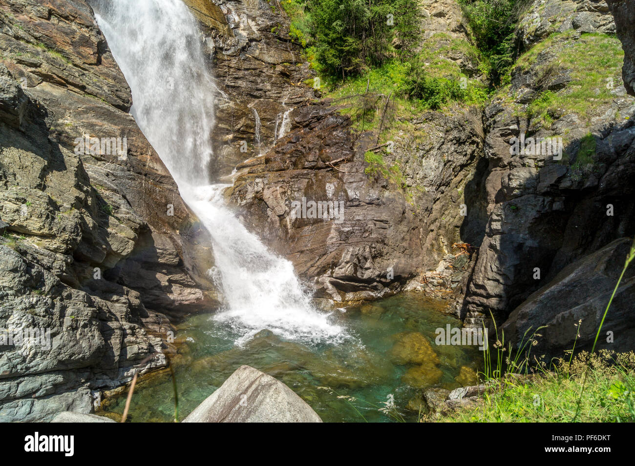 waterfall in the mountains among the rocks Stock Photo - Alamy