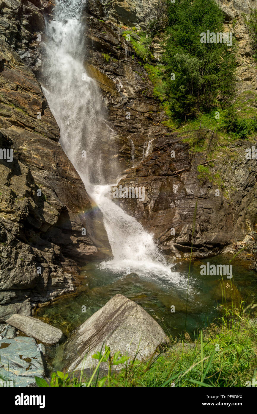 waterfall in the mountains among the rocks Stock Photo - Alamy