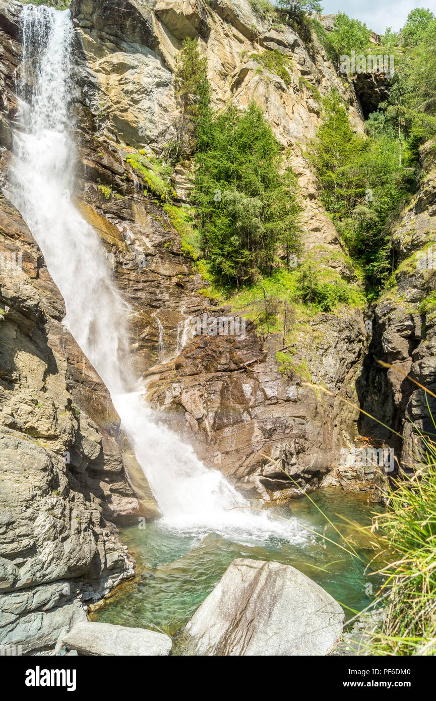 waterfall in the mountains among the rocks Stock Photo - Alamy