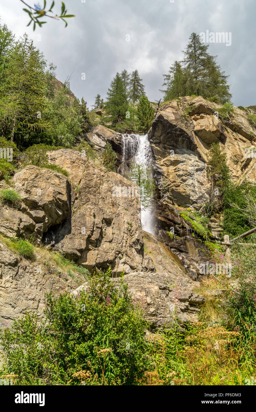 waterfall in the mountains among the rocks Stock Photo - Alamy