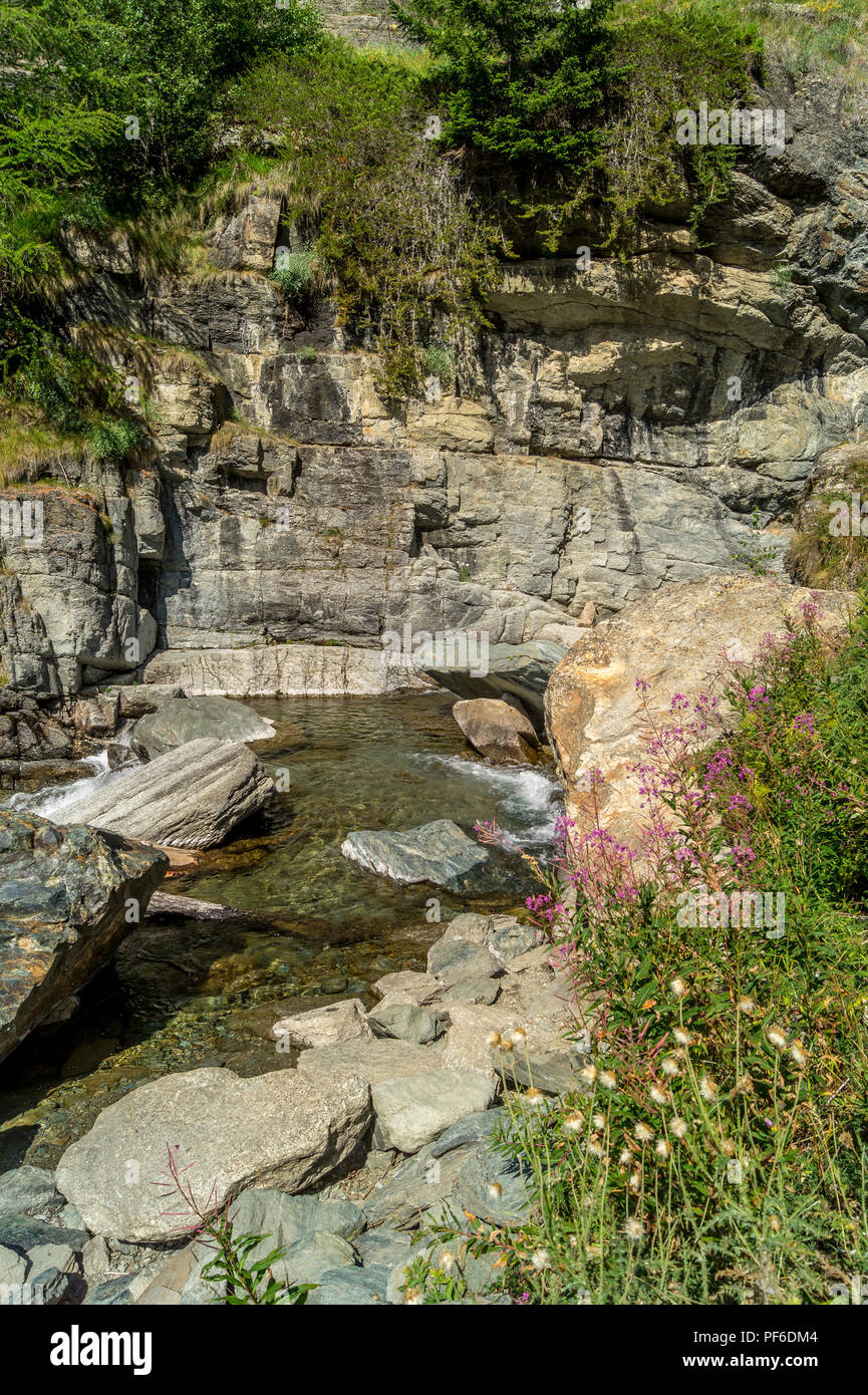 waterfall in the mountains among the rocks Stock Photo - Alamy