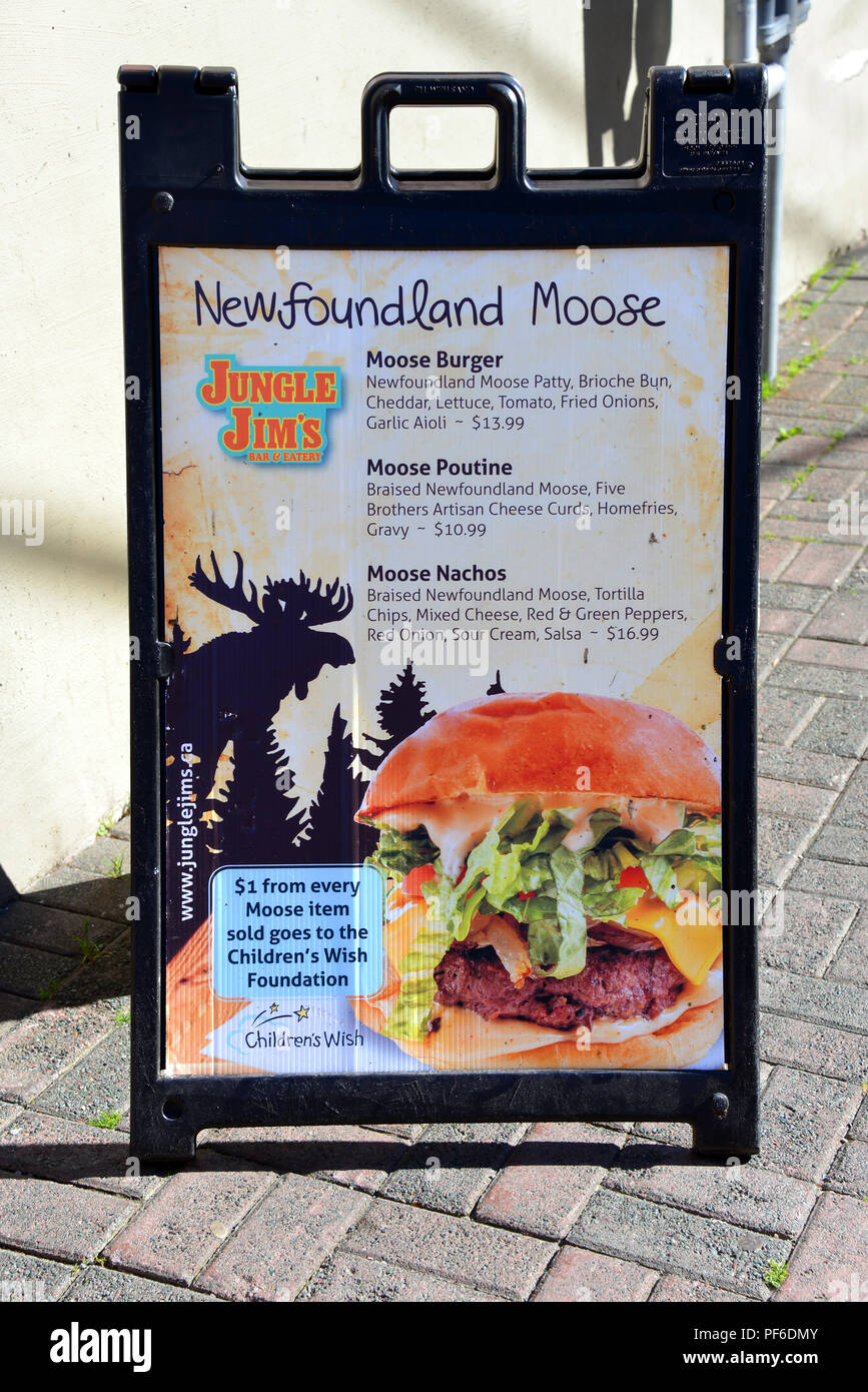 St. John’s, NL, Canada - August 11, 2018:  Sign for Moose meat products outside Jungle Jim’s Bar and Eatery a Newfoundland based restaurant Stock Photo