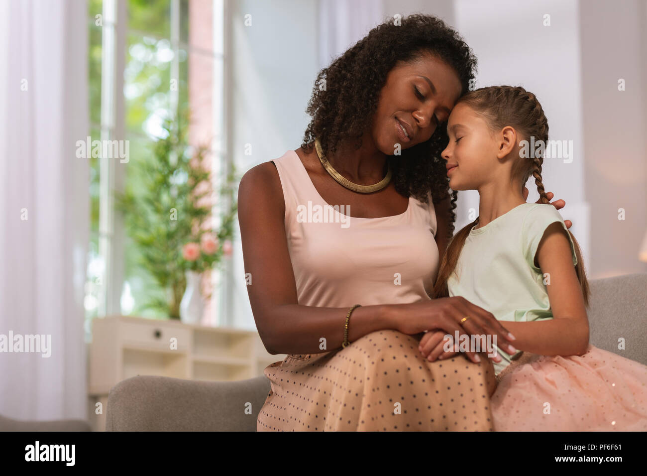 Pleasant caring mother being with her daughter Stock Photo