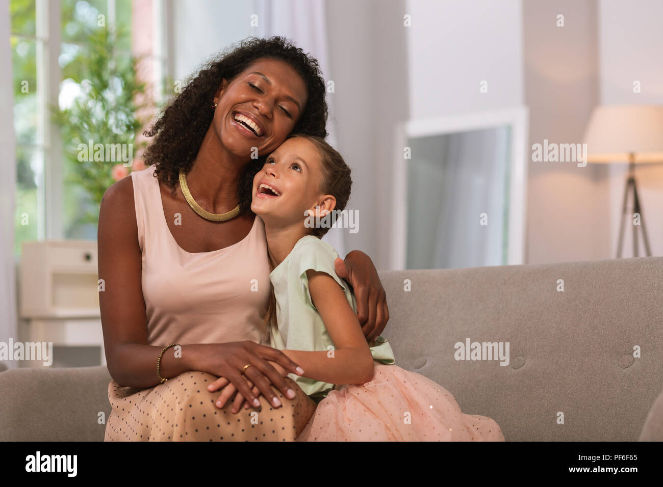 Nice cute mother and daughter being in a great mood Stock Photo