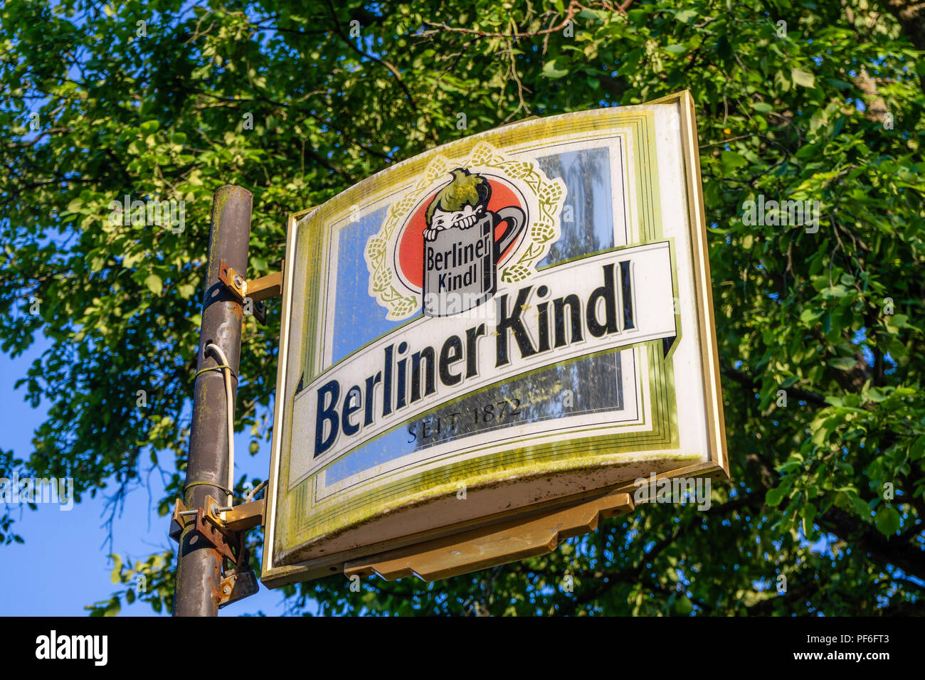Old and weathered 'Berliner Kindl' sign outside a closed pub, Berlin, Germany Stock Photo