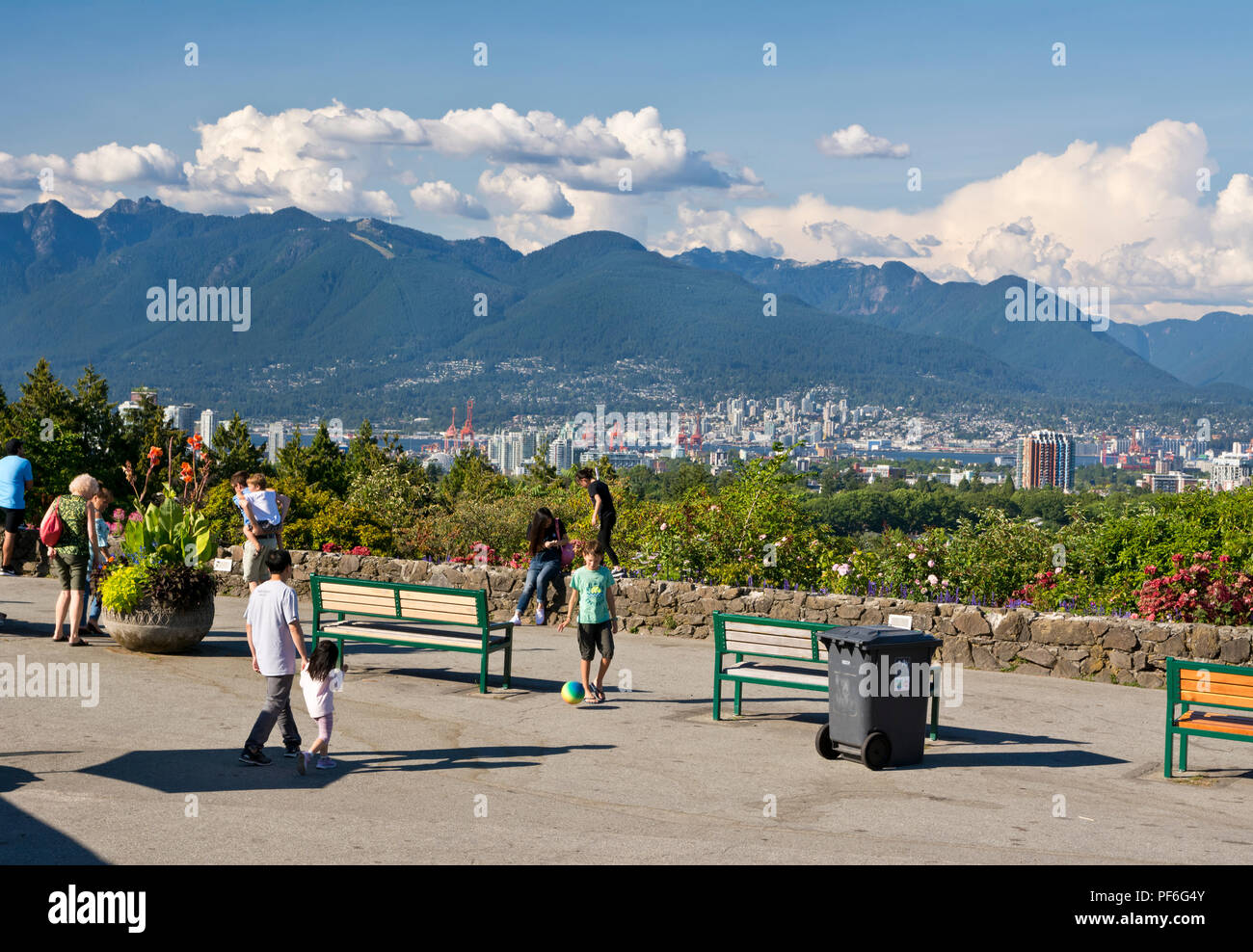 Queen Elizabeth Park in Vancouver, BC Canada.  People observing the scenic view of the city and mountains. Stock Photo
