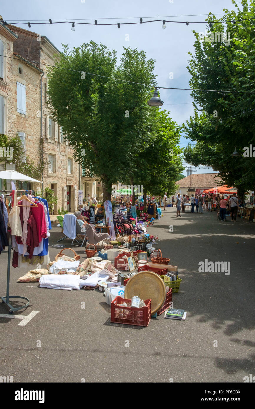 Penne d'Agenais, France - 24th June 2018: Plenty of people come out on a sunny Sunday morning to inspect the stalls at the flea market and table-top sale in picturesque hilltop Penne d'Agenais, Lot et Garonne, France Stock Photo