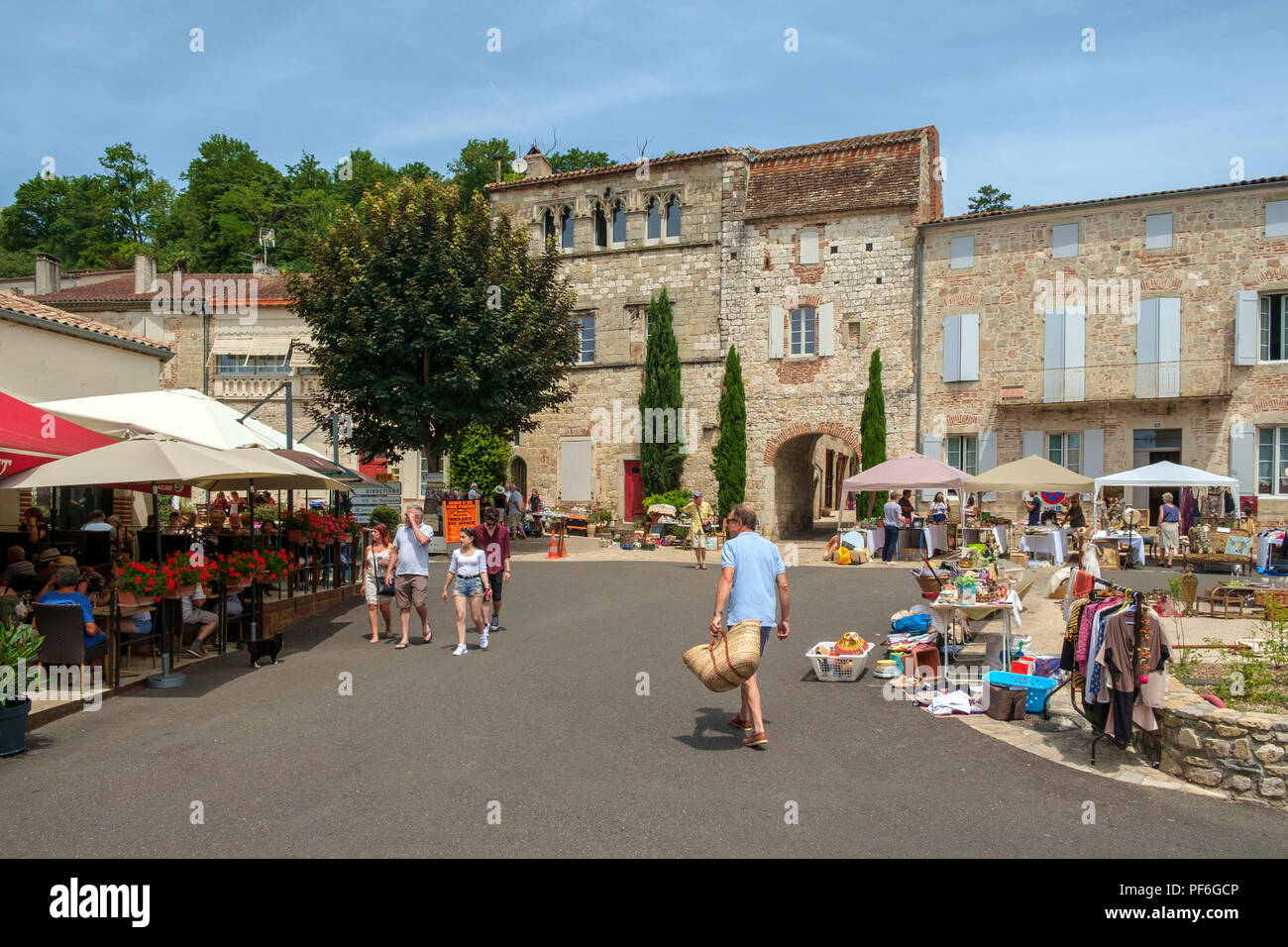 Penne d'Agenais, France - 24th June 2018: Plenty of people come out on a sunny Sunday morning to inspect the stalls at the flea market and table-top sale in picturesque hilltop Penne d'Agenais, Lot et Garonne, France Stock Photo