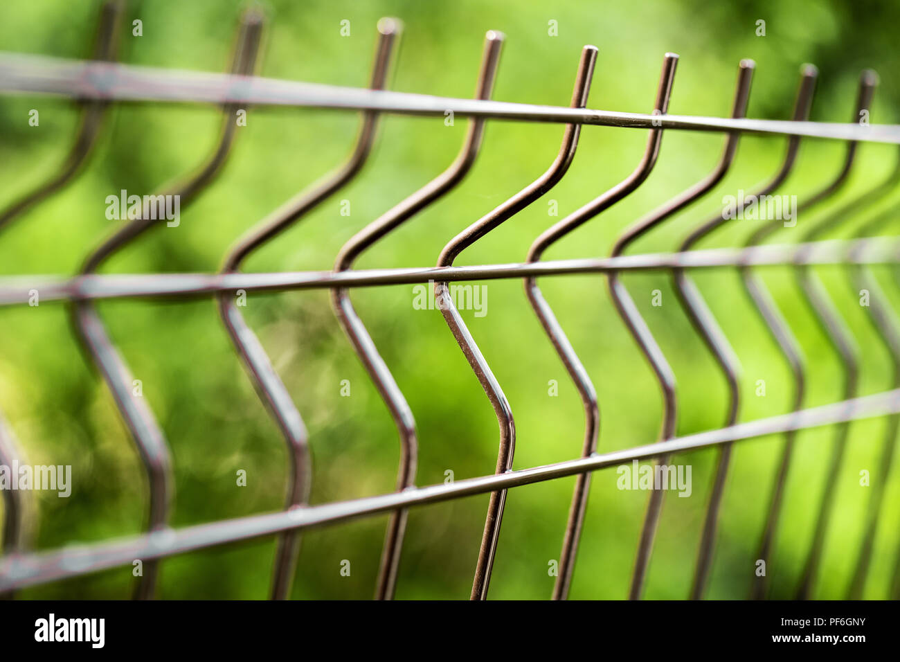 curved welded steel fence closeup Stock Photo