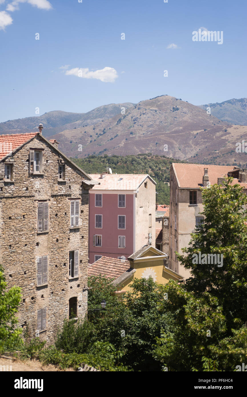 A view across residential property and the Church in Corte, Corsica, France, Europe Stock Photo