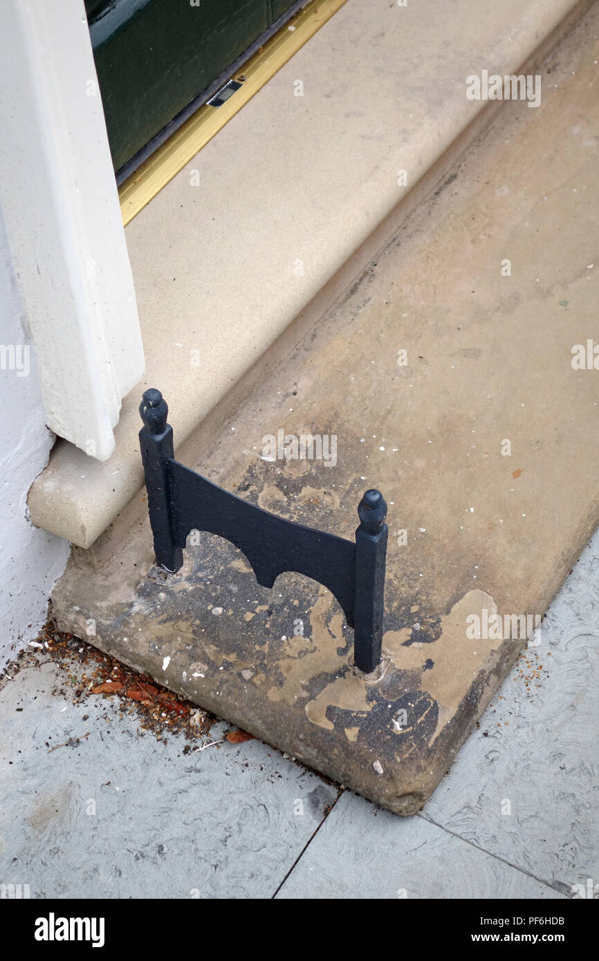 Hand cast wrought iron foot boot scraper Stock Photo Alamy