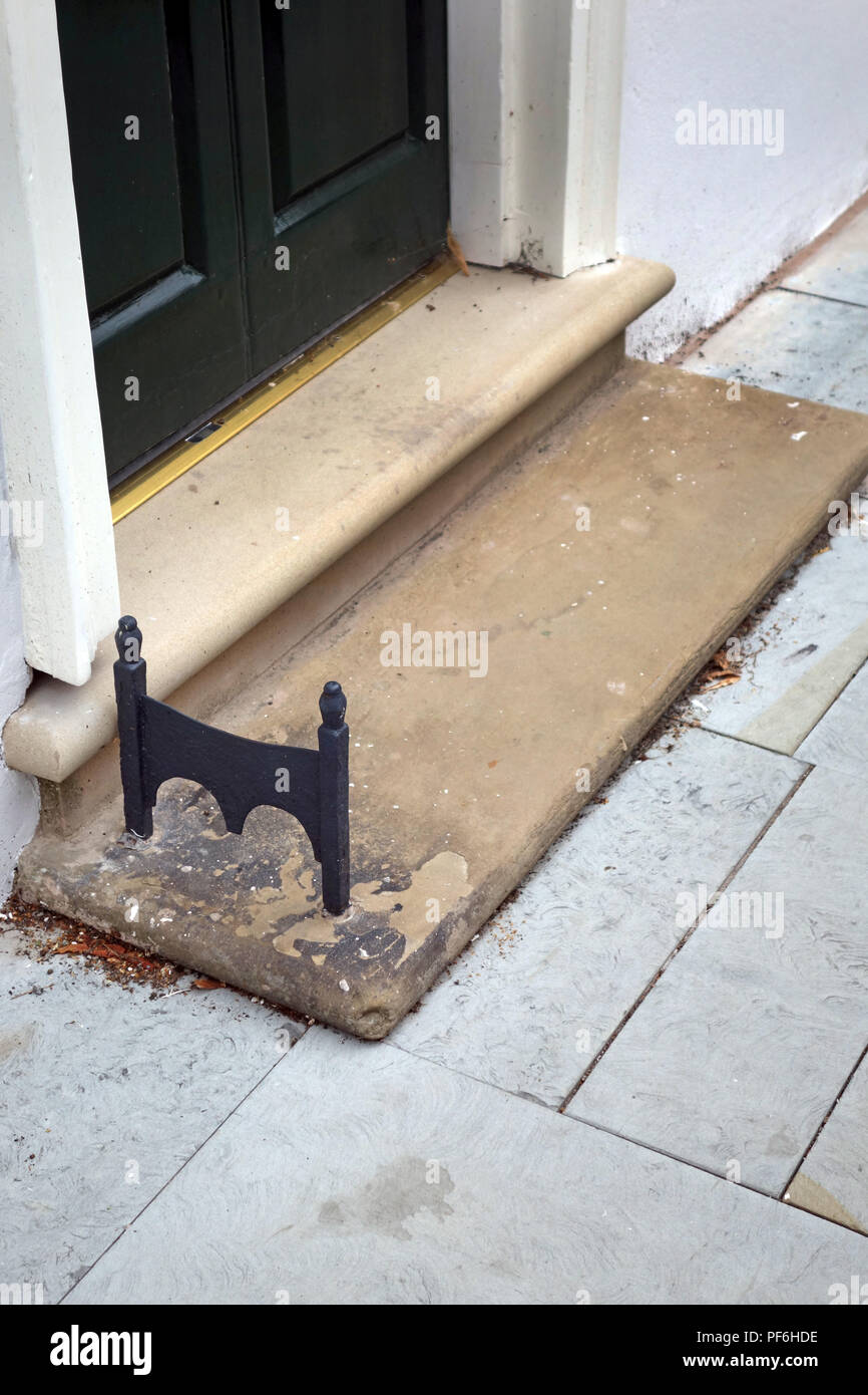 Steps near front door with boot scraper hi res stock photography
