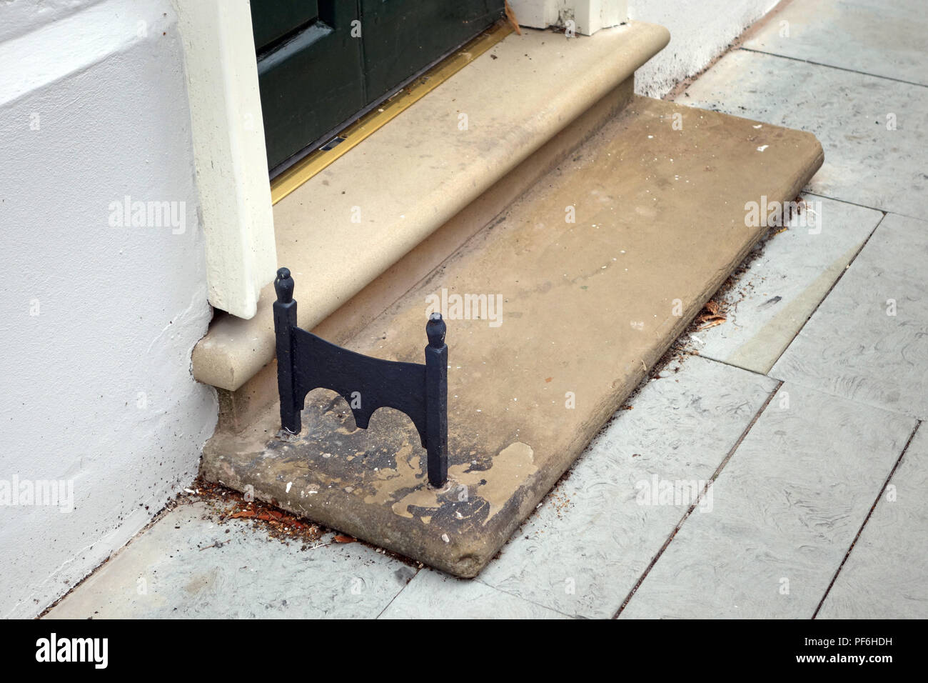 Hand cast wrought iron foot boot scraper Stock Photo Alamy