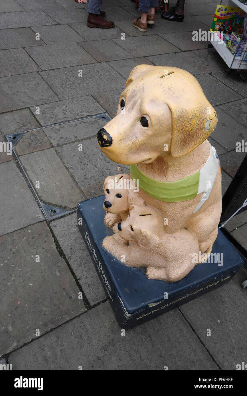 Fibreglass Collection Dog and puppies collecting for The Guide Dogs for the Blind Association, a British charitable organisation founded in 1934 Stock Photo