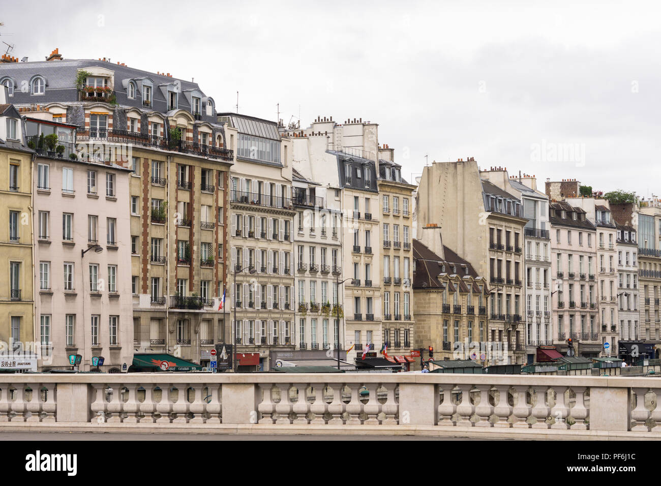 Paris cityscape - Buildings on Quai des Grands Augustins as seen from the Saint Michel bridge in Paris, France, Europe. Stock Photo