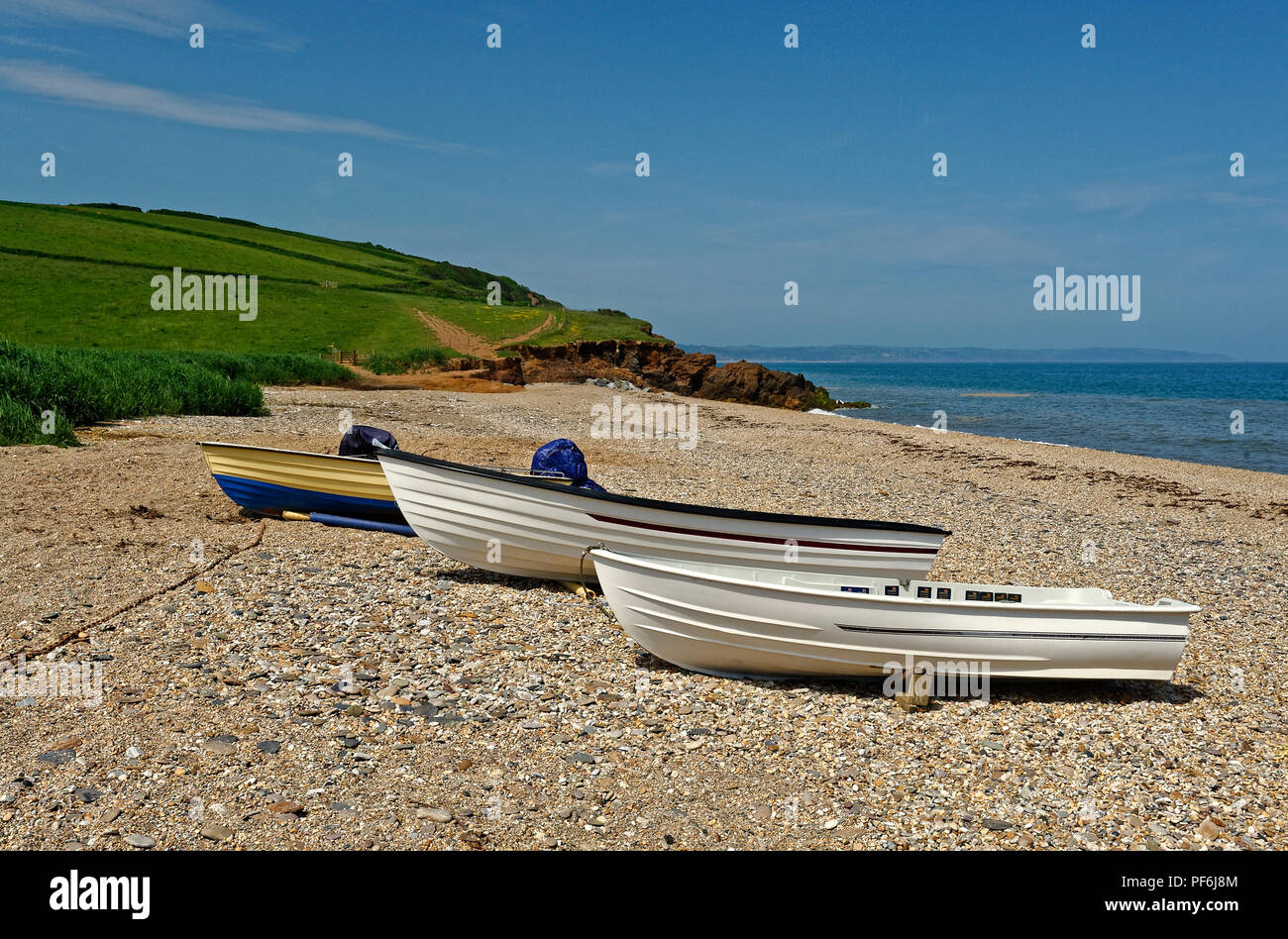 3  boats on a Devon Sea shore beesands Stock Photo