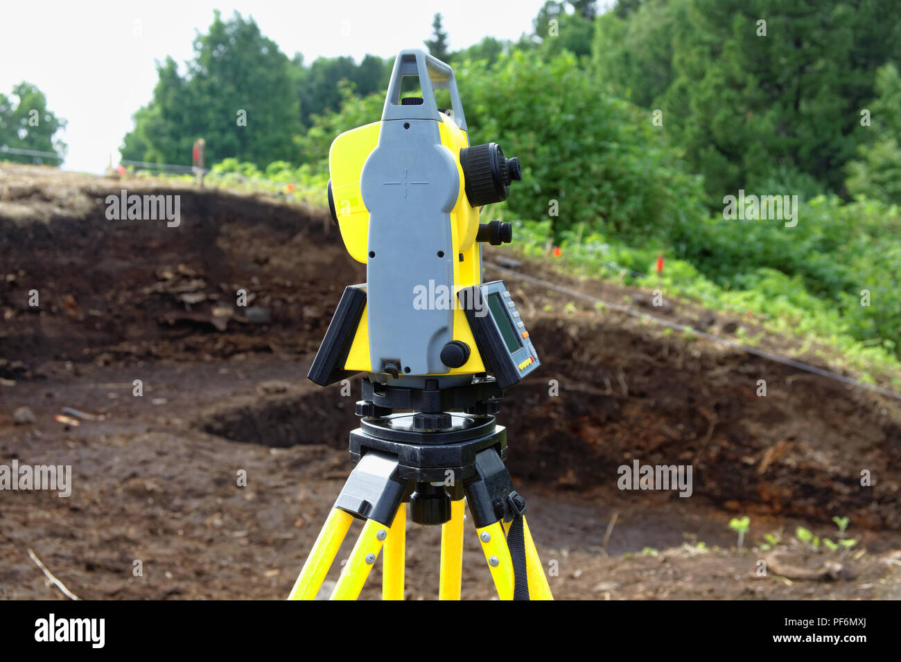 A modern tacheometer is used for field work in archeology. It is ...