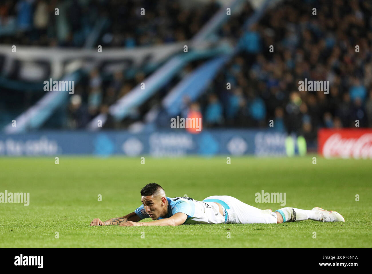 BUENOS AIRES, ARGENTINA - AUGUST 2018: Ricardo Centurion (Racing) lying on the ground on the match Racing - Velez Stock Photo
