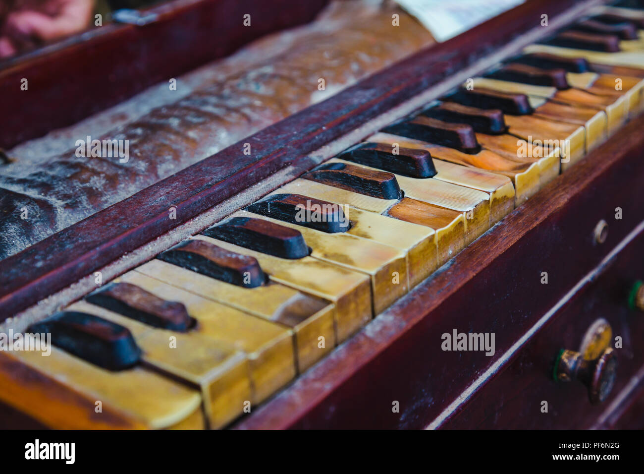 Close-up of  Shot of Traditional Old and Dusty Harmonium Keyboard. Stock Photo