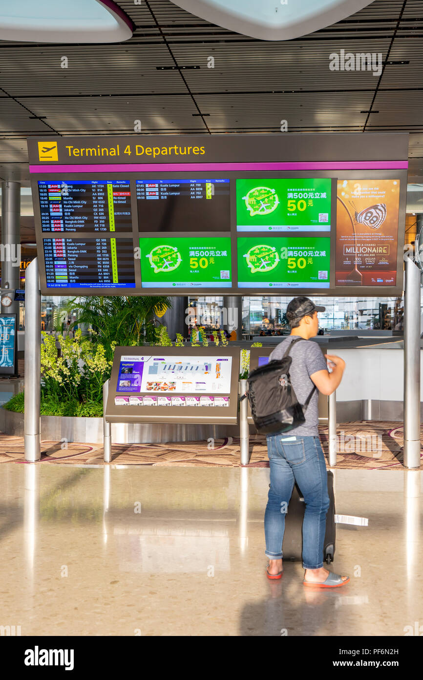 Singapore - July 14, 2018: Departure Board in Changi Airport. Departure Hall Singapore. It has 4 passenger terminals, and it is one of the largest tra Stock Photo