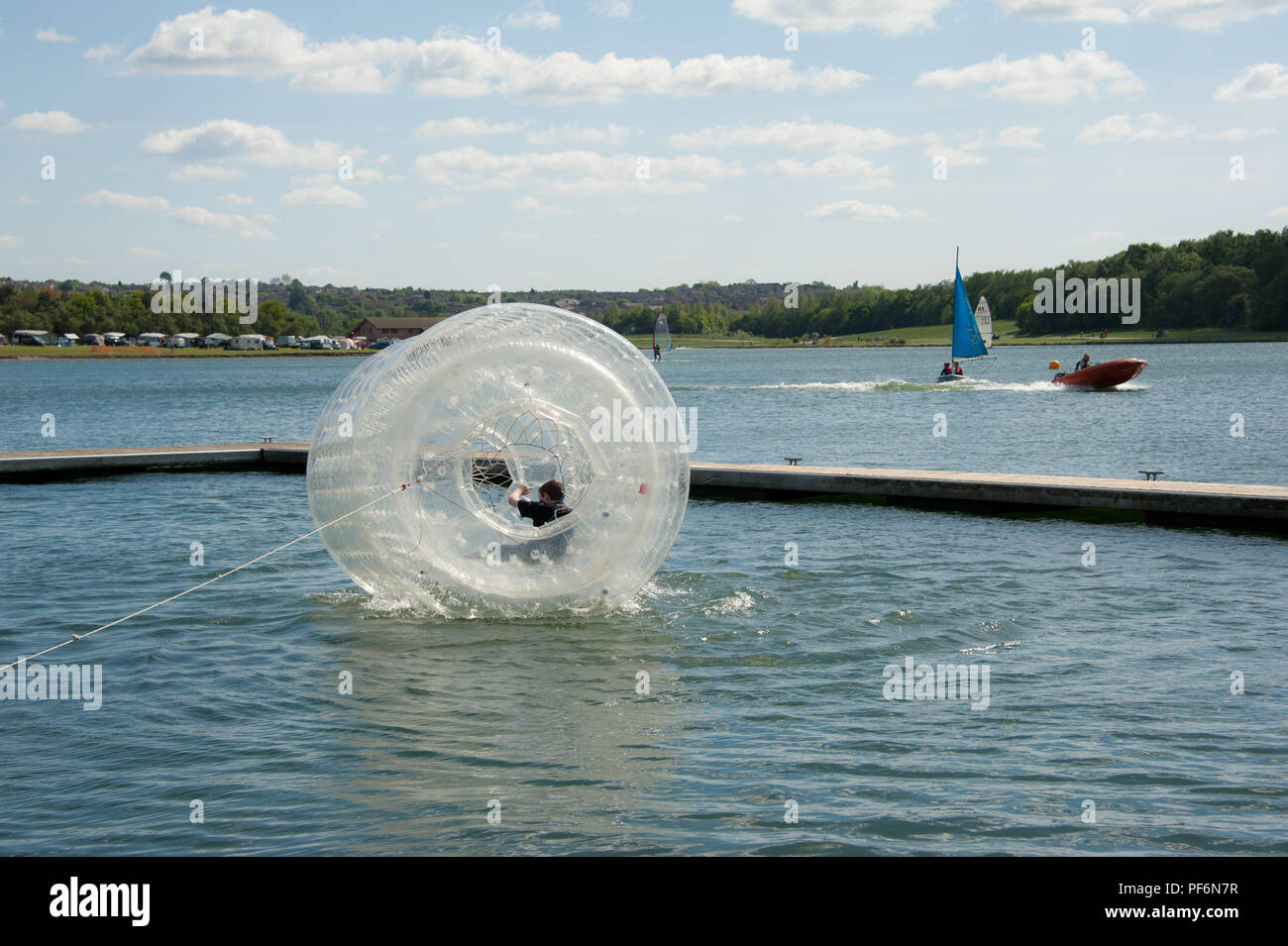 Zorbing in Rother Valley Country Park offers fun and recreational activities for all the family in Rotherham South Yorkshire UK Stock Photo