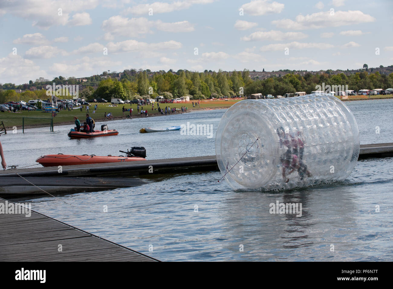 Zorbing in Rother Valley Country Park offers fun and recreational activities for all the family in Rotherham South Yorkshire UK Stock Photo