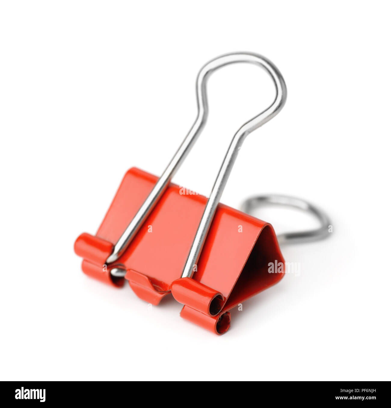 Red metal binder clip isolated on white Stock Photo