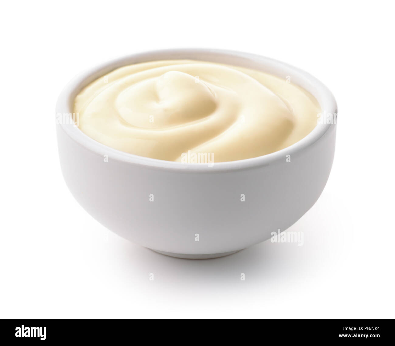 Ceramic dip bowl full of mayonnaise isolated on white Stock Photo