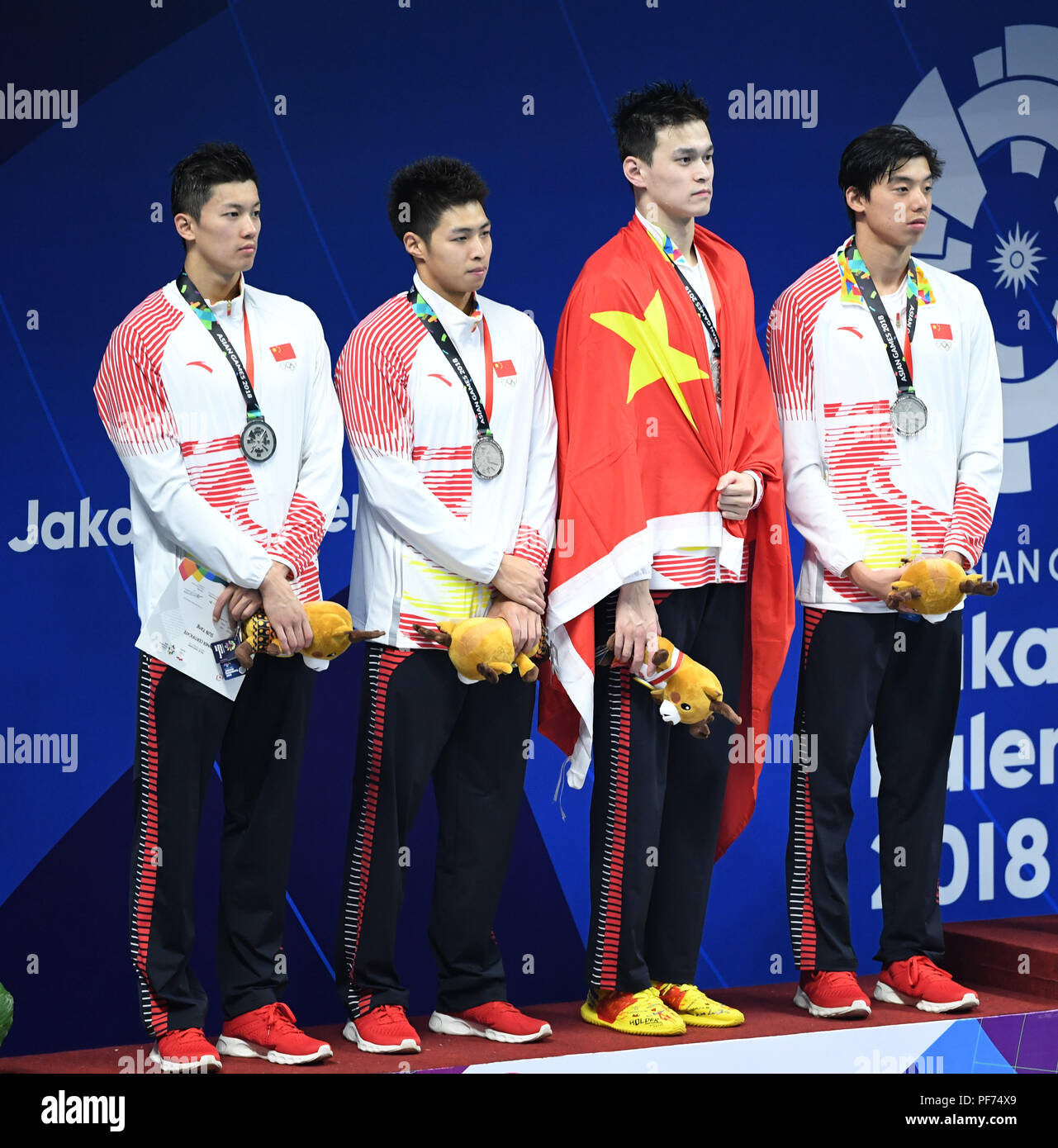 Jakarta, Indonesia. 20th Aug, 2018. Wang Shun, Shang Keyuan, Sun Yang and Ji Xinjie (from L to R) of China attend the awarding ceremony of Men's 4x200m Freestyle Relay Final in the 18th Asian Games in Jakarta, Indonesia, Aug. 20, 2018. China won the silver medal. Credit: Du Yu/Xinhua/Alamy Live News Credit: Xinhua/Alamy Live News Stock Photo