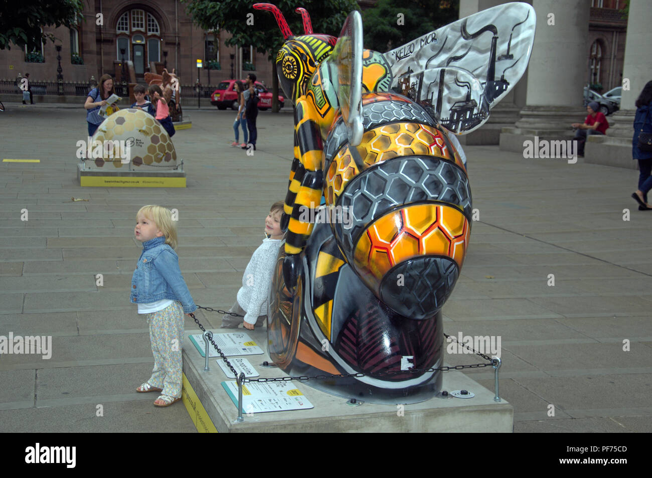 Manchester UK, 20 August, 2018. People in Manchester explore the 'Bee in the City' free, family-fun trail. Over 100 Bees are in the trail which ends 23 September. Credit: Terry Waller/Alamy Live News Stock Photo