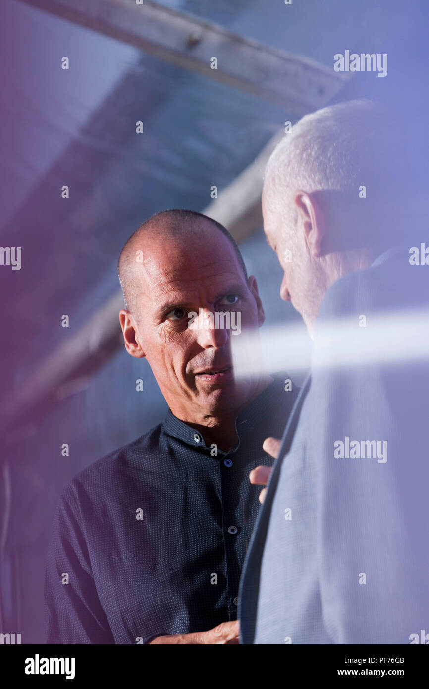 Edinburgh, UK. 20th August, 2018. Jeremy Corbyn (foreground) with Yanis Varoufakis. DiEM25 co-founder Yanis Varoufakis discusses with the Labour leader the renaissance of the left and the future of democracy. Pictured at the Edinburgh International Book Festival. Edinburgh, Scotland.  Picture by Gary Doak / Alamy Live News Stock Photo