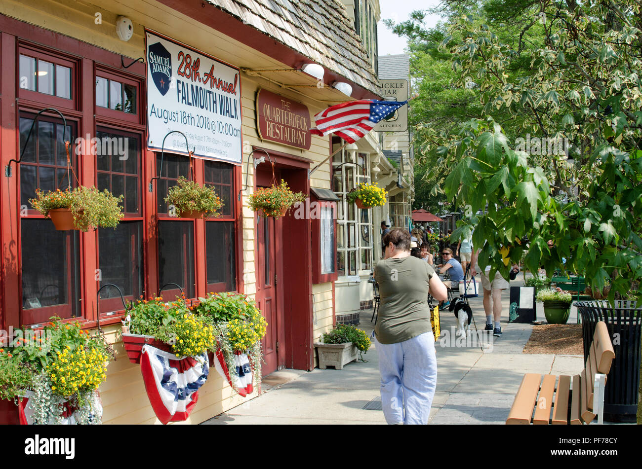 Downtown Falmouth, Cape Cod, Massachusetts summer street scene with people outside the Quarterdeck restaurant Stock Photo