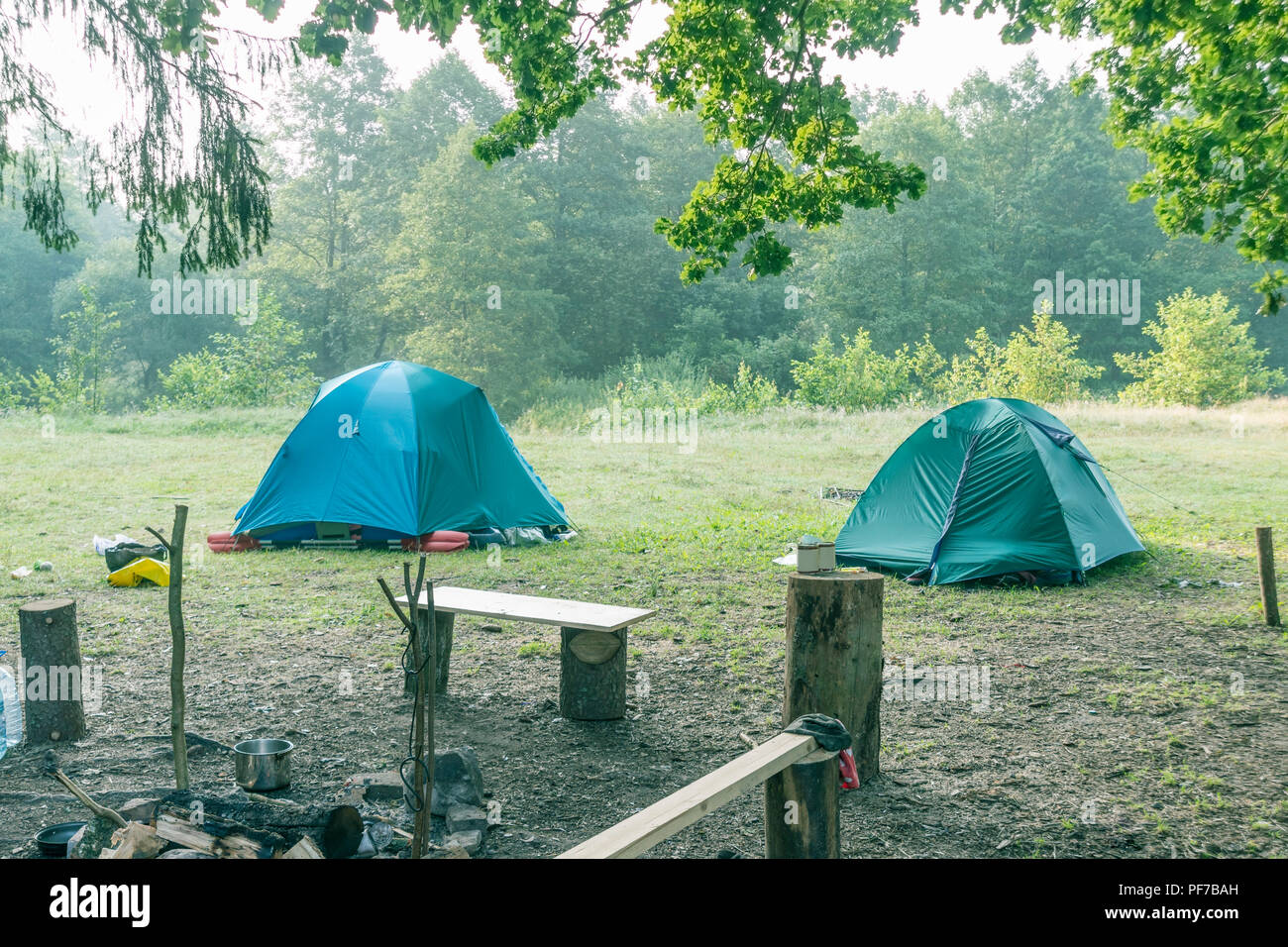 two tent domes at campsite by summer morning Stock Photo