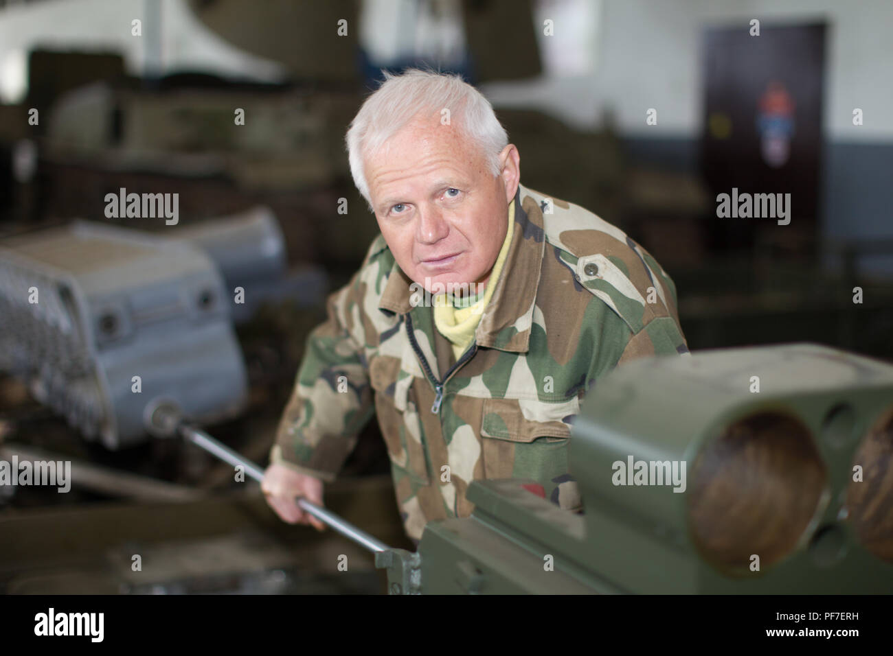Belarus, Gomel, April 27, 2018. Military factory.Military worker repairing tanks Stock Photo