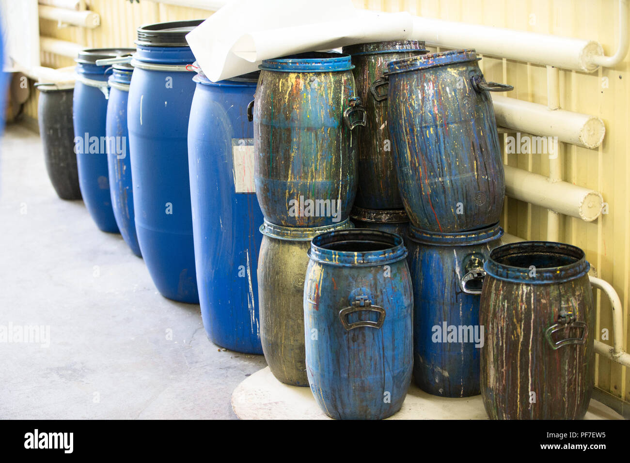 Plastic barrels with paint Stock Photo Alamy