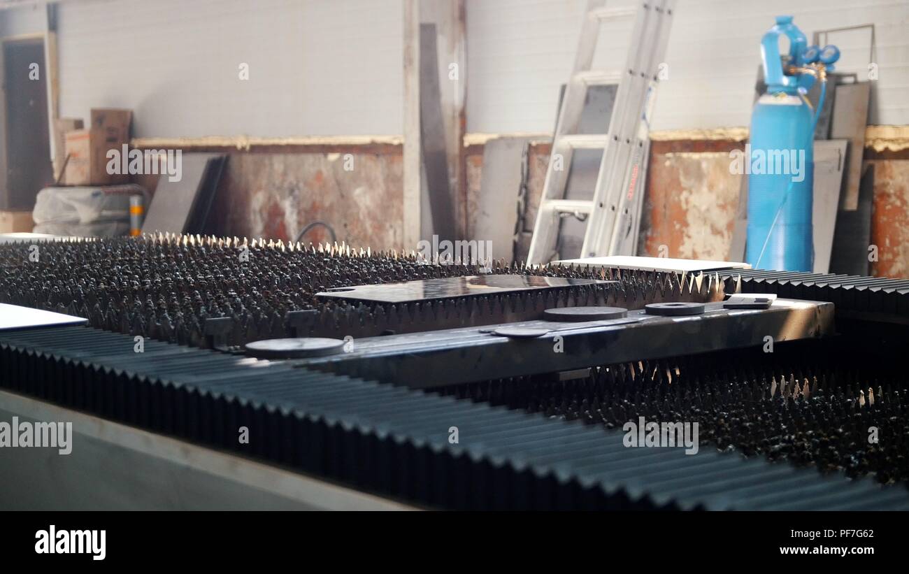In the foreground, metal sheets of various shapes and sizes Stock Photo