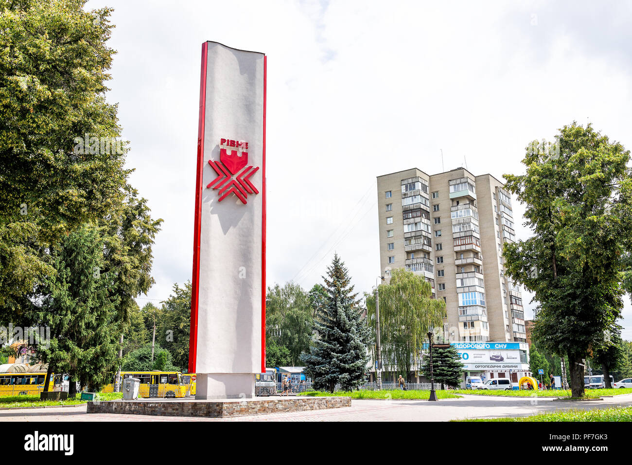 Rivne, Ukraine - July 25, 2018: Red monument sign for Rovno city in western Ukraine by railway railroad rail train station in outdoor park in summer Stock Photo
