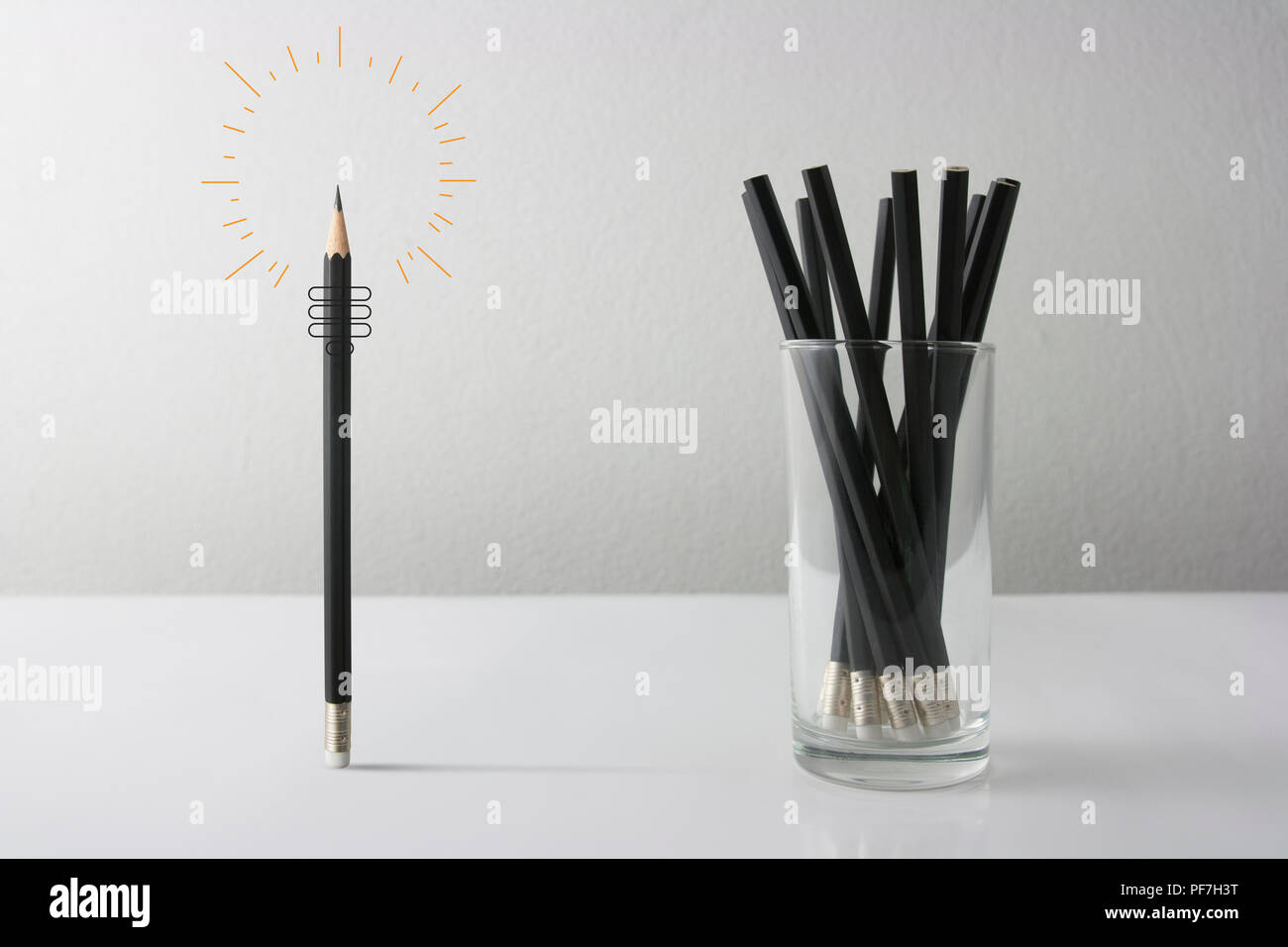 Individuality symbol and independent thinker concept and new leadership concept or individuality as a group of Pencil on white paper with one individu Stock Photo