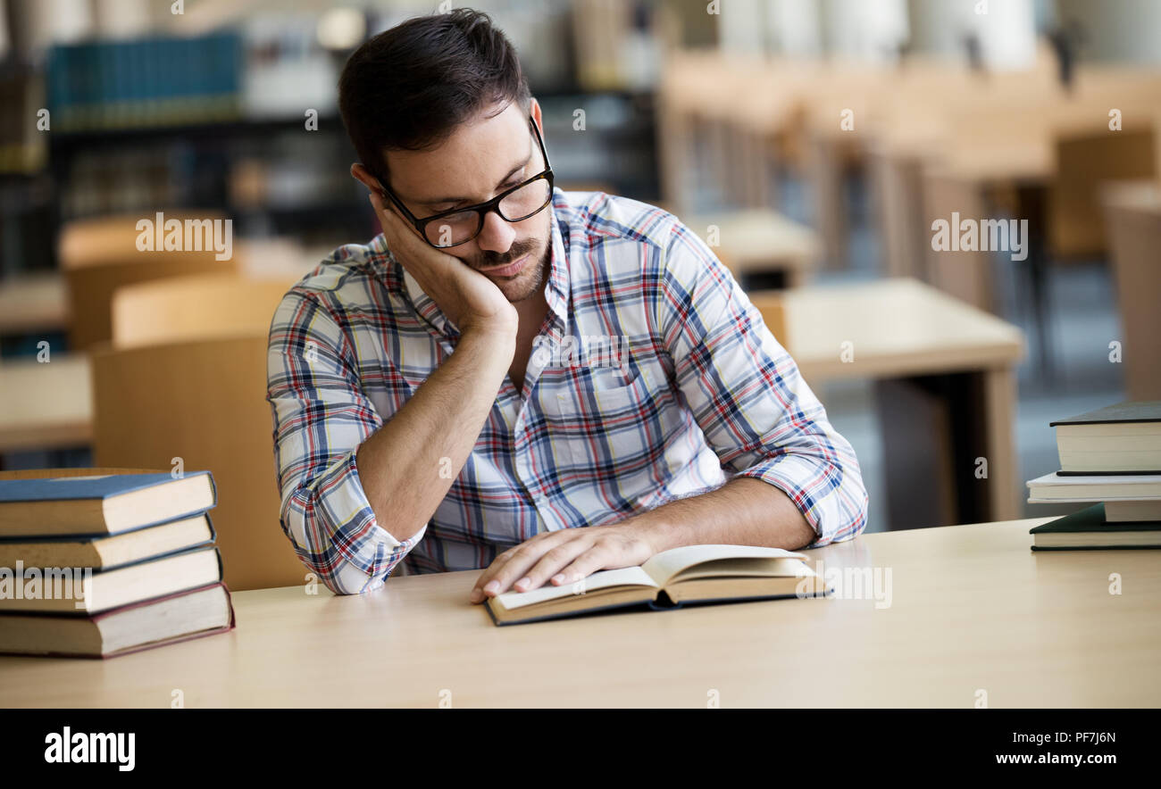 Portrait of caucasian male student sitting at the desk Stock Photo