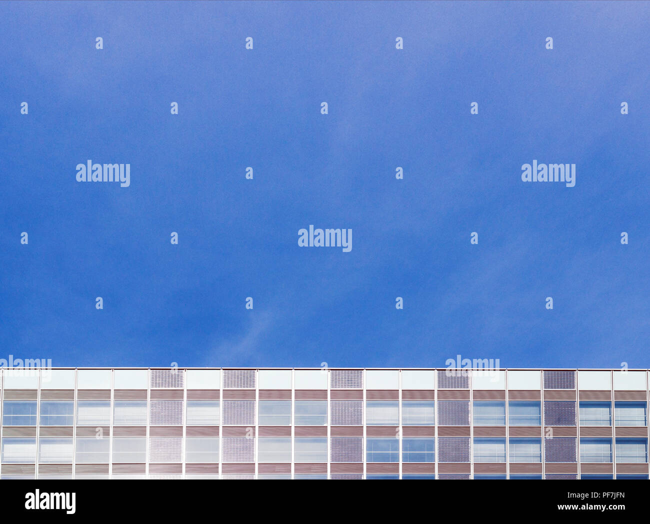 Facade of a modern apartment building. Blue Sky Stock Photo - Alamy