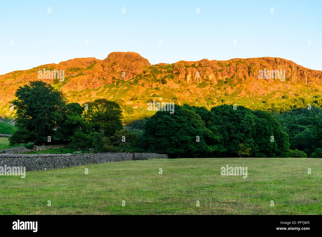 Evening light on Gate Crag near Boot in upper Eskdale in the Lake District Stock Photo