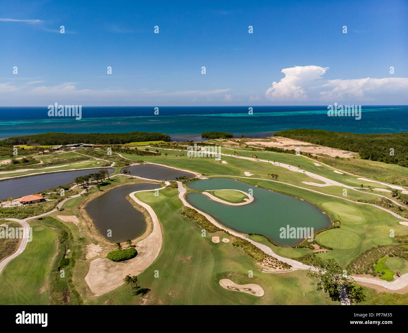 Aerial View of Tropical Golf Course with Ocean Background Stock Photo